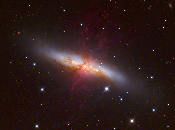 This comparison image shows a supernova suddenly appearing in the nearby galaxy M82. BLOCK